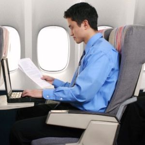 Passengers On A Flight Doing Pending Work